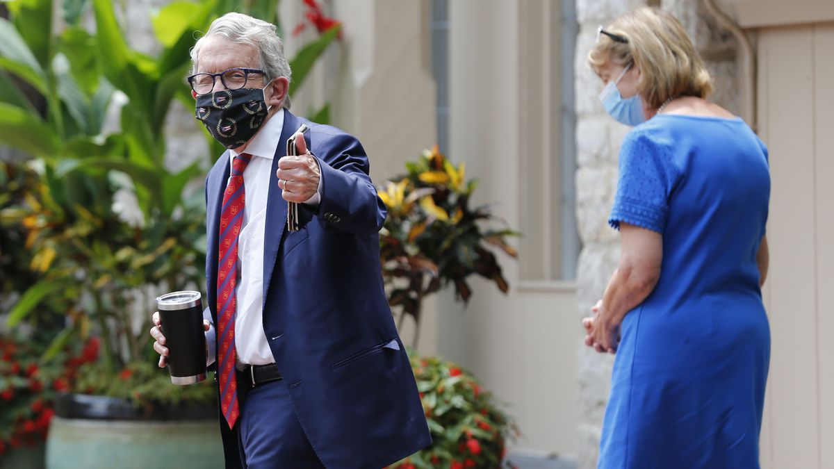 Ohio Governor Mike DeWine, left, and his wife Fran, walk into their residence after he tested positive for COVID-19 earlier in the day Thursday, Aug. 6, 2020, in Bexley, Ohio.