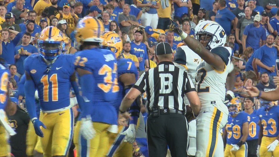 CJ Donaldson points the Pitt defenders to a first down after a huge gain