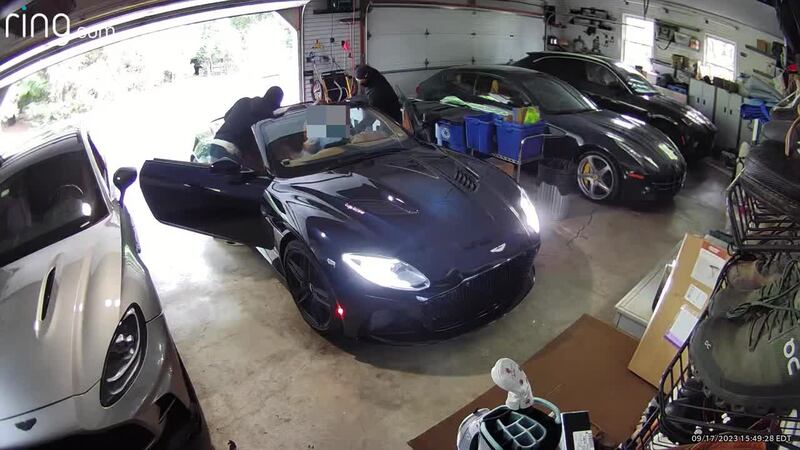 The man told police he had returned home when two suspects entered his garage.