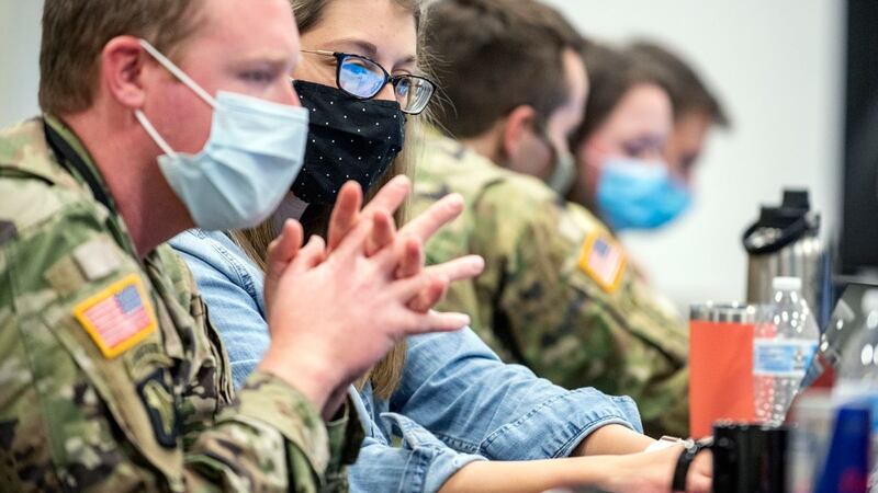 WVU computer science major Heather Fetty works with members on the West Virginia National...