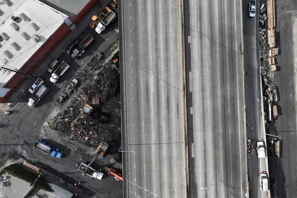 The site of a fire is seen under Interstate 10, Monday, Nov. 13, 2023, in Los Angeles. Los...