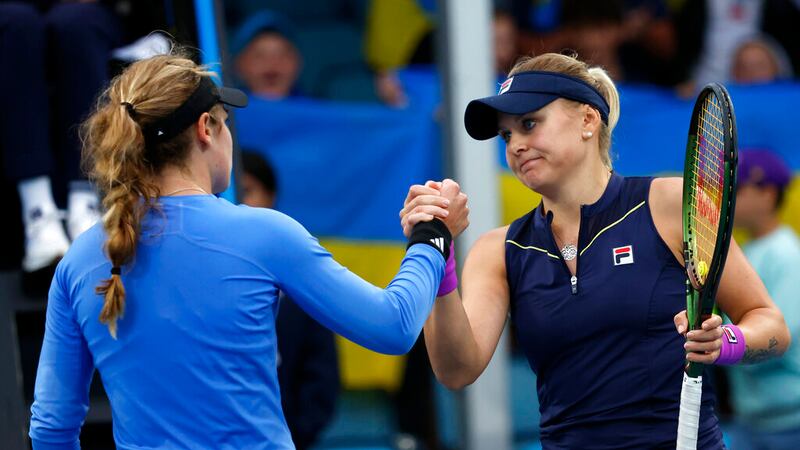 Kateryna Baindl, right, of Ukraine is congratulated by Catherine McNally of the U.S. following...