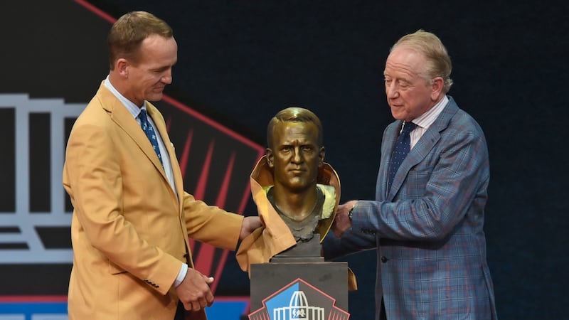 Peyton Manning, left, a member of the Pro Football Hall of Fame Class of 2021, and his...