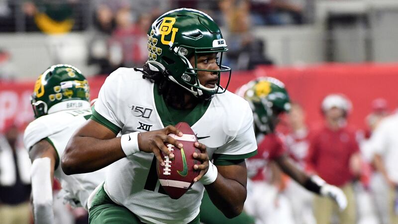 FILE - In this Dec. 7, 2019, file photo, Baylor quarterback Gerry Bohanon (11) rolls out to...