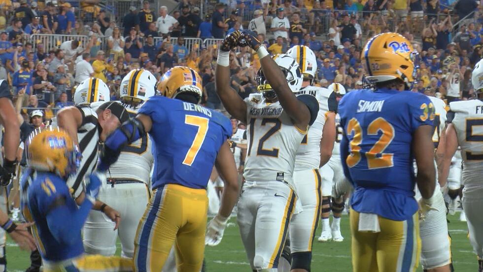 CJ Donaldson celebrates in front of the Pitt student section following his first college...